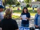 Voters discussing concerns about Casey Askar's past outside a polling station.